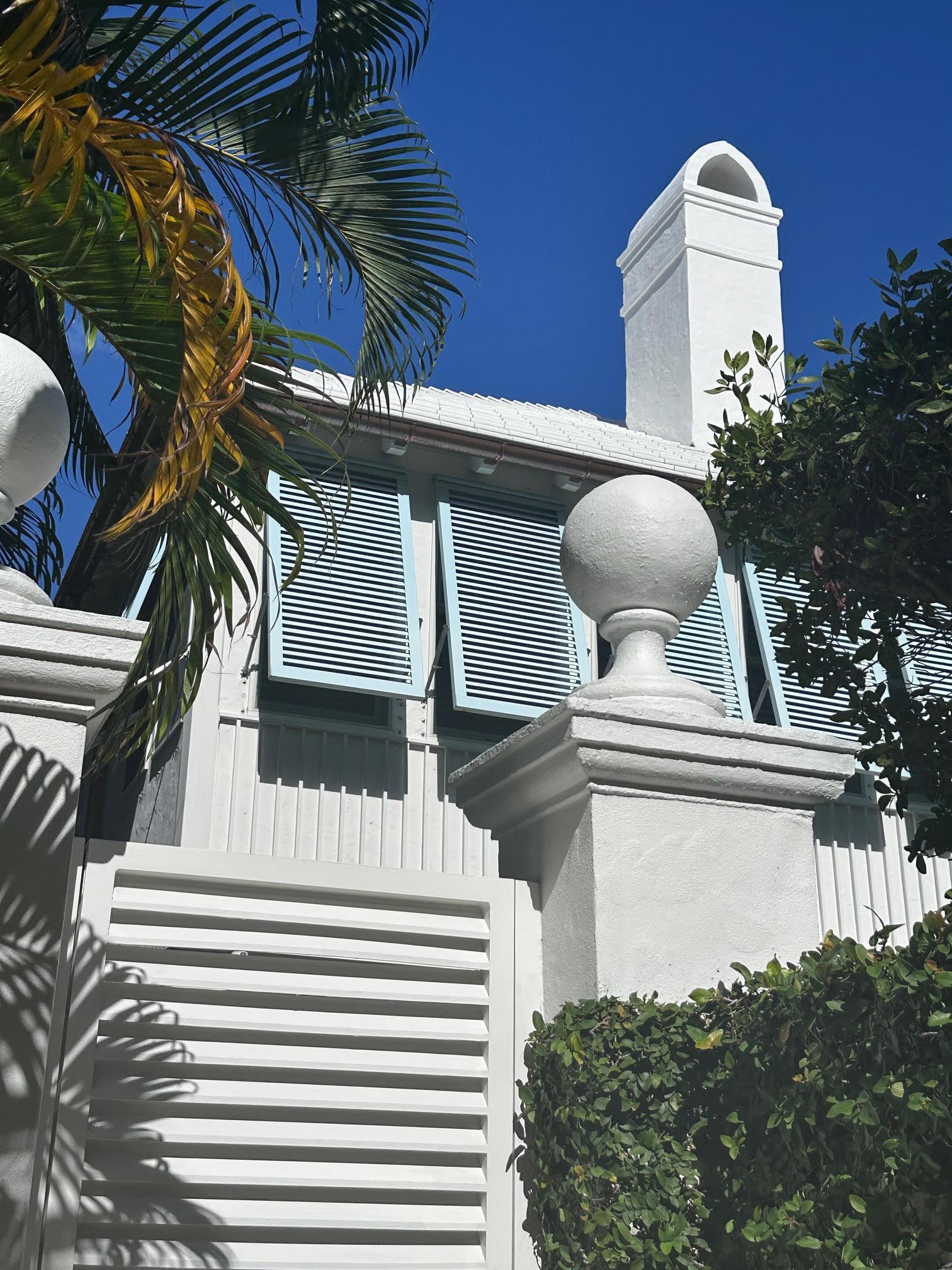 Southeast Florida Private Residence - Creaton Visio Roof Tiles with blue window shutters and white facade.